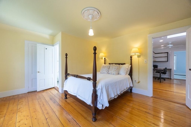 75 Union St, Holliston, MA 01746 - bedroom with light wood-style floors, an office area, and baseboard heating
