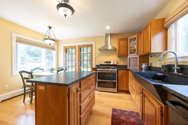 75 Union St, Holliston, MA 01746 - kitchen featuring range with two ovens, wall chimney exhaust hood, dishwashing machine, brown cabinets, and dark countertops