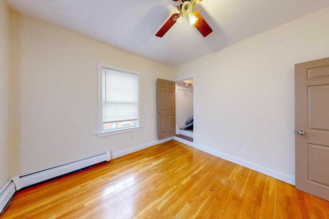 2 Waumbeck St, Boston, MA 02121 - unfurnished bedroom with ceiling fan, baseboard heating, and light hardwood / wood-style floors