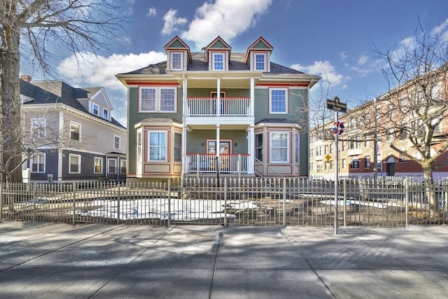 2 Waumbeck St, Boston, MA 02121 - view of front facade with a porch and a balcony