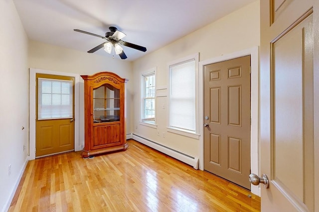 2 Waumbeck St, Boston, MA 02121 - entryway with ceiling fan, baseboard heating, and light wood-type flooring