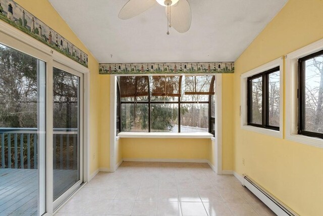 unfurnished sunroom with a baseboard heating unit, a ceiling fan, and vaulted ceiling