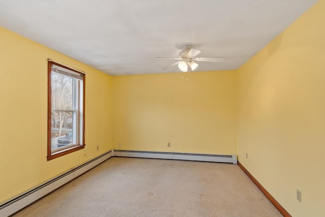 unfurnished room with light carpet, ceiling fan, a baseboard heating unit, and baseboards