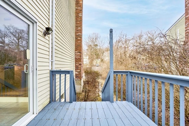 wooden terrace with outdoor dining area