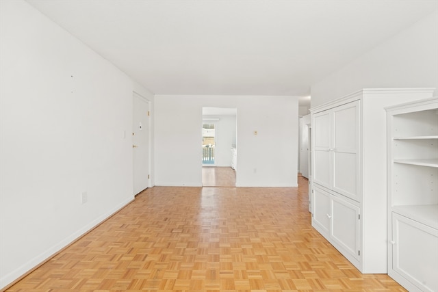 spare room with light parquet floors