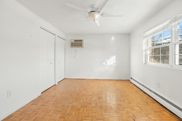 unfurnished room featuring ceiling fan, baseboard heating, a wall mounted AC, and light parquet flooring