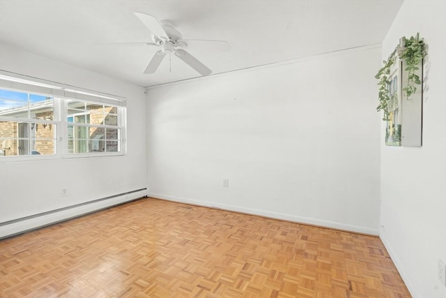 spare room featuring light parquet floors, ceiling fan, and a baseboard radiator