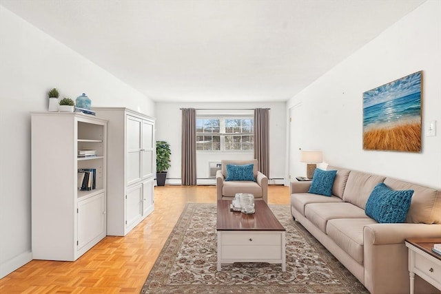 living room with light parquet flooring and a baseboard radiator