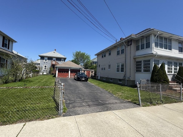 252-256 Billings St, Quincy, MA 02169 - view of home's exterior featuring a garage and an outdoor structure