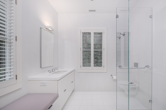 bathroom featuring an enclosed shower, tile flooring, large vanity, and toilet