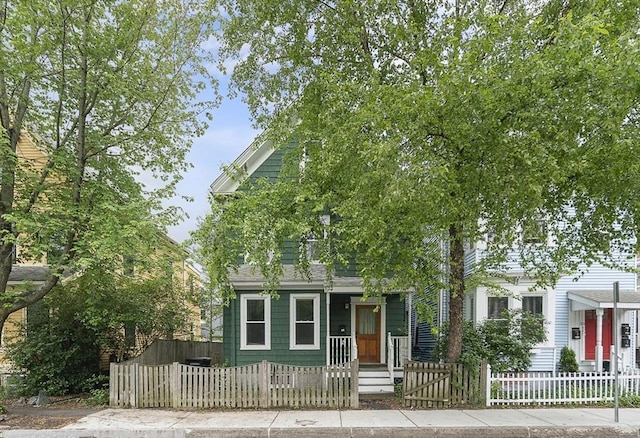 28 Summer St Unit 1, Somerville, MA 02143 - obstructed view of property featuring a fenced front yard and a gate