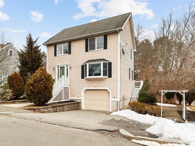 view of front of property with a garage and driveway