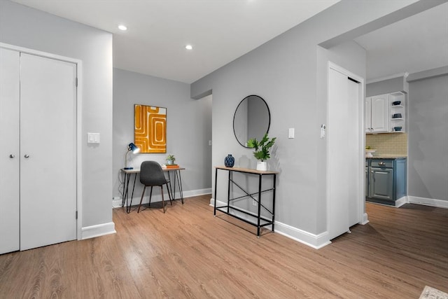 hallway with light wood-type flooring