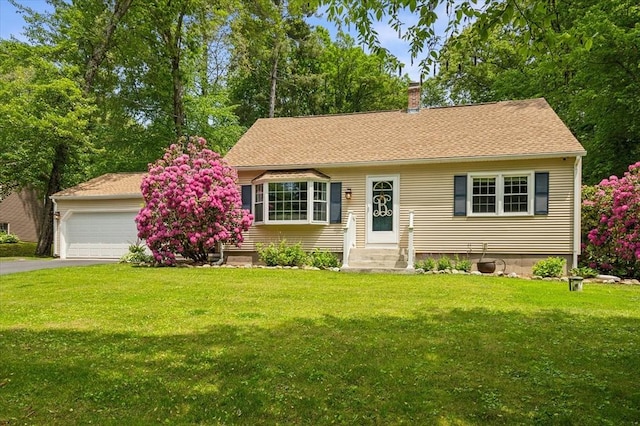 24 S Loomis St, Southwick, MA 01077 - view of front facade featuring a chimney, a front yard, driveway, and entry steps
