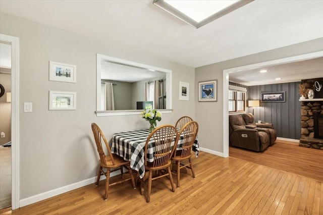 24 S Loomis St, Southwick, MA 01077 - dining room featuring hardwood / wood-style floors, baseboards, and a stone fireplace