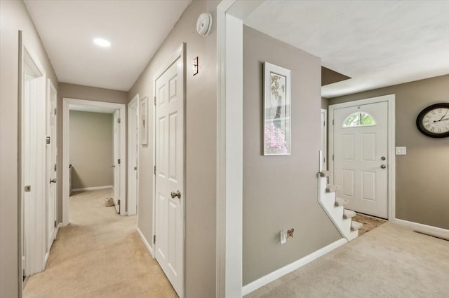 24 S Loomis St, Southwick, MA 01077 - entryway with light colored carpet, baseboards, and stairs