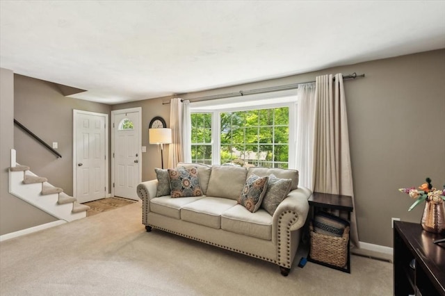 24 S Loomis St, Southwick, MA 01077 - living room featuring light carpet, stairs, and baseboards