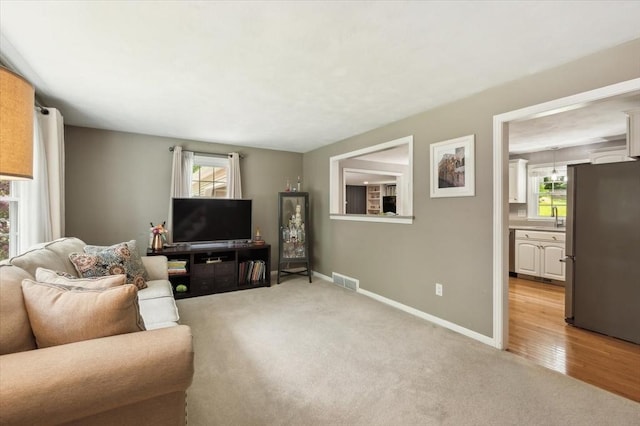24 S Loomis St, Southwick, MA 01077 - living room with baseboards and light colored carpet
