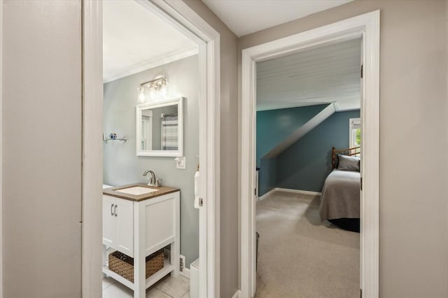 24 S Loomis St, Southwick, MA 01077 - hallway with a sink, baseboards, lofted ceiling, and light carpet