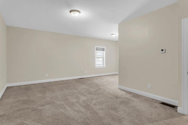 spare room with light carpet