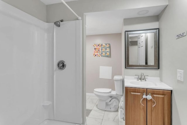 bathroom with walk in shower, vanity, and toilet