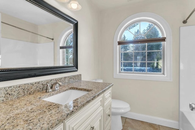 full bathroom featuring tile patterned flooring, vanity,  shower combination, and toilet