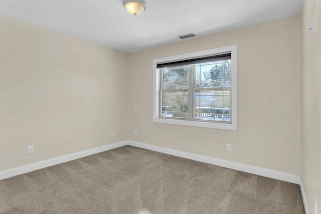 unfurnished room with carpet floors