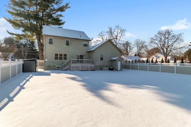 back of house with a wooden deck