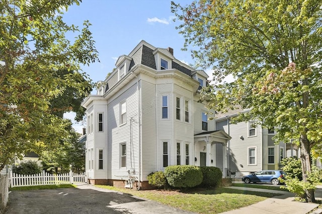 14 Grand View Ave, Somerville, MA 02143 - view of property exterior with mansard roof and a chimney