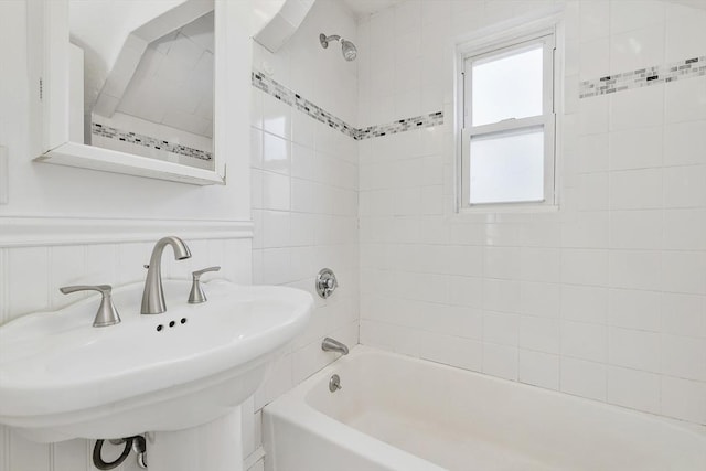 14 Grand View Ave, Somerville, MA 02143 - bathroom featuring a sink, shower / bath combination, and wainscoting