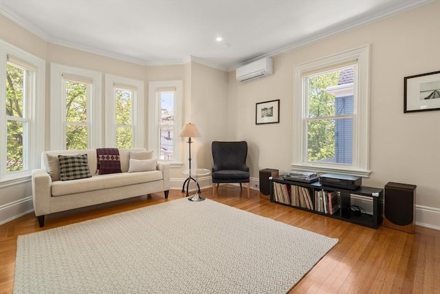 14 Grand View Ave, Somerville, MA 02143 - sitting room featuring ornamental molding, a wall unit AC, wood finished floors, baseboards, and recessed lighting