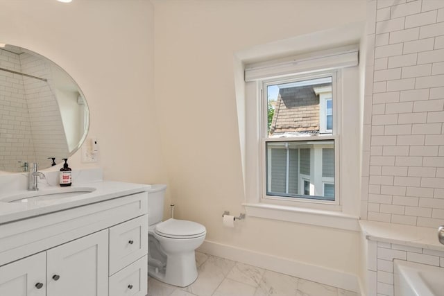 14 Grand View Ave, Somerville, MA 02143 - bathroom featuring vanity, marble look tiles, toilet, and baseboards