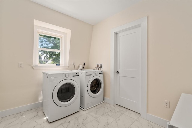 14 Grand View Ave, Somerville, MA 02143 - laundry room featuring separate washer and dryer, light marble finish flooring, and baseboards