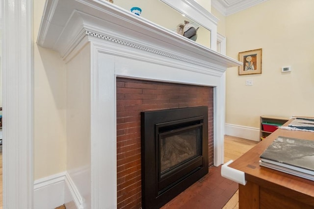 14 Grand View Ave, Somerville, MA 02143 - detailed view of crown molding, a brick fireplace, and wood finished floors