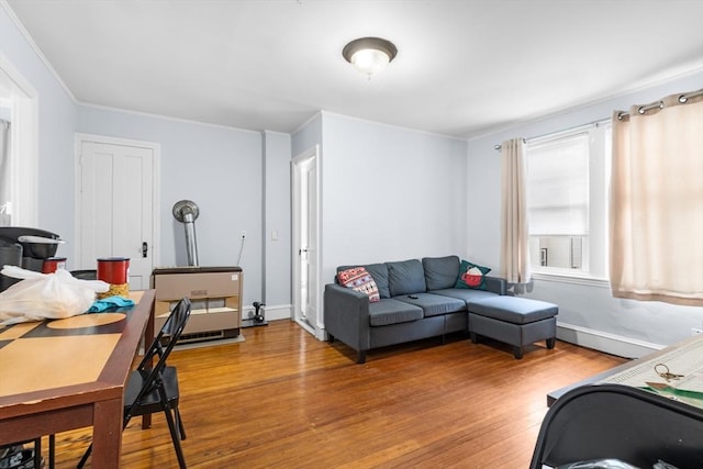 living room with ornamental molding and hardwood / wood-style flooring