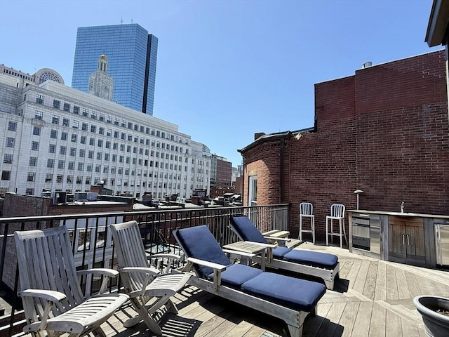 wooden deck with a view of city