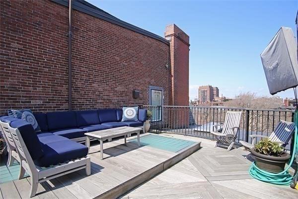 wooden deck featuring an outdoor hangout area