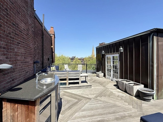deck featuring an outdoor living space and french doors