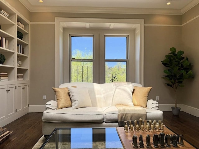 living room featuring dark wood-style floors, baseboards, crown molding, and recessed lighting