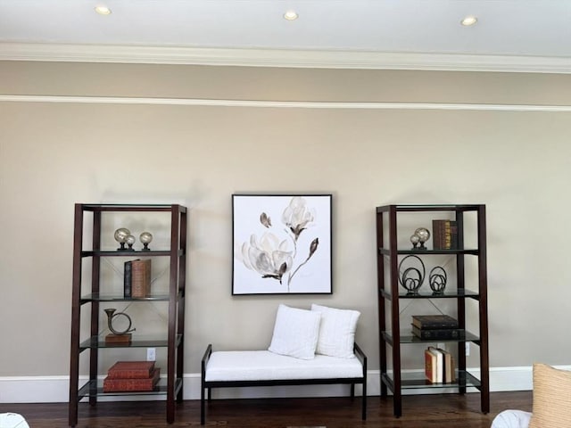 sitting room featuring crown molding, baseboards, recessed lighting, and dark wood-type flooring