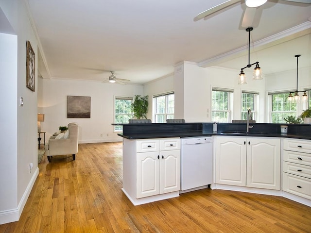 3 Eliza Ln, Dartmouth, MA 02747 - kitchen featuring dishwasher, a ceiling fan, dark countertops, open floor plan, and crown molding