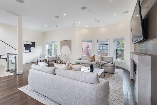 living room featuring dark wood-type flooring