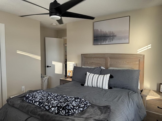 bedroom with ceiling fan and wood-type flooring