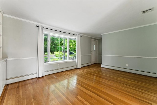 205 Mosier St, South Hadley, MA 01075 - unfurnished room with a baseboard radiator, a baseboard heating unit, wood finished floors, and ornamental molding