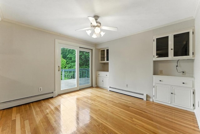 205 Mosier St, South Hadley, MA 01075 - unfurnished room with baseboard heating, crown molding, light wood-style floors, and a ceiling fan