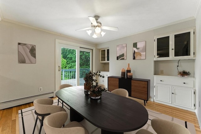 205 Mosier St, South Hadley, MA 01075 - dining space featuring a baseboard radiator, crown molding, light wood-style floors, and a ceiling fan
