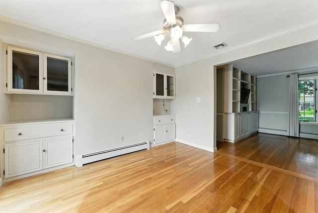 205 Mosier St, South Hadley, MA 01075 - unfurnished room featuring baseboard heating, light wood-style flooring, ceiling fan, and ornamental molding