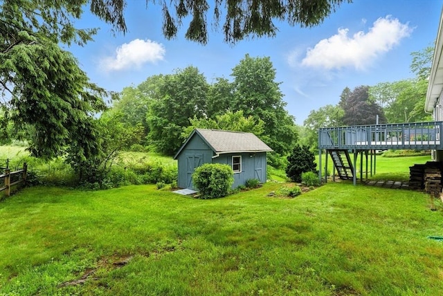 205 Mosier St, South Hadley, MA 01075 - view of yard featuring stairway, a wooden deck, and a shed