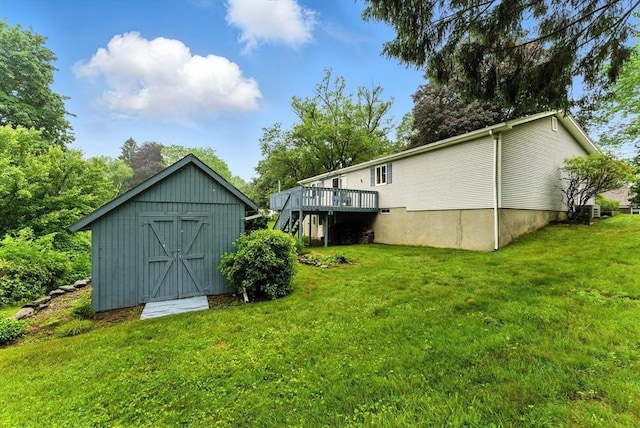 205 Mosier St, South Hadley, MA 01075 - view of grassy yard with a wooden deck, stairway, and a shed