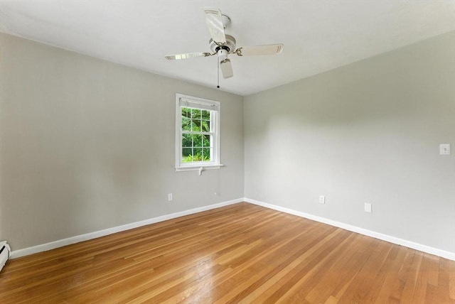 205 Mosier St, South Hadley, MA 01075 - empty room featuring light wood-style floors, ceiling fan, and baseboard heating